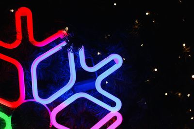 Close-up of illuminated christmas tree at night