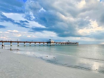 Pier over sea against sky