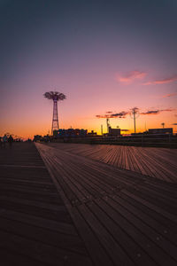 Silhouette built structure against sky during sunset