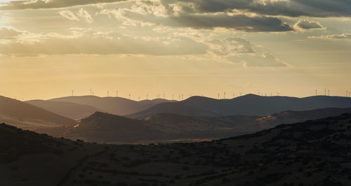 Scenic view of mountains against sky during sunset