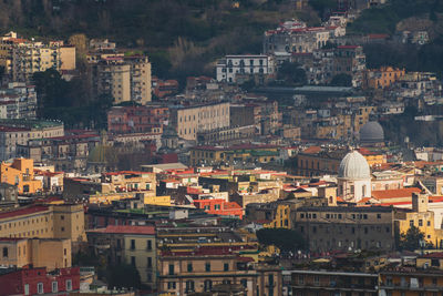 High angle view of  buildings illuminated by sunbeam in naples italy 