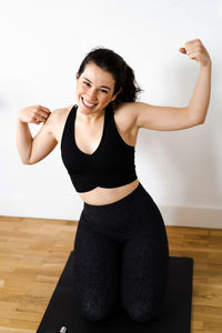 Young woman exercising in gym