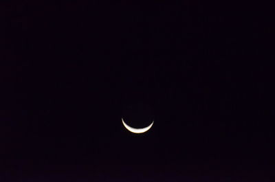 Low angle view of moon against sky at night