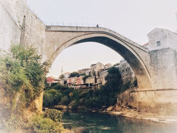 Bridge over river against clear sky