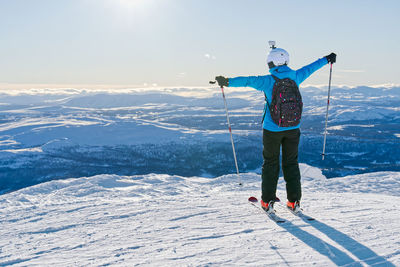 Full length of man skiing on snowcapped mountain