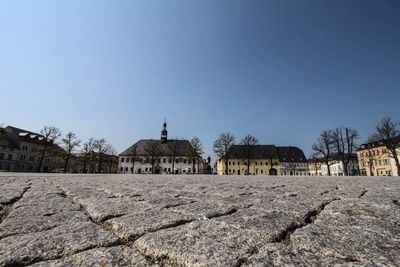 Panoramic shot of buildings against clear sky