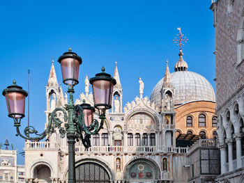 Low angle view of historic building against clear blue sky