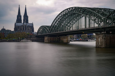 View of bridge over river in city