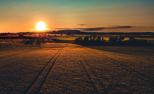 Scenic view of landscape against sky during sunset