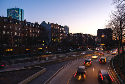 Cars on street at dusk