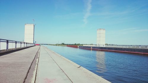View of factory against blue sky
