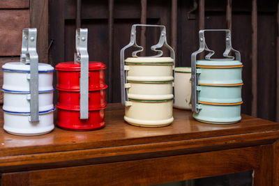 Multi colored lunch boxes on table