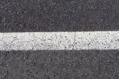 High angle view of road sign on street