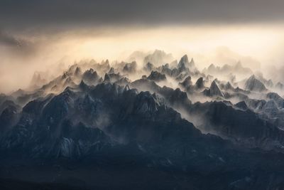 Scenic view of mountains against sky during sunset