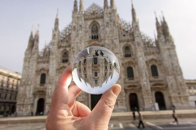 Close-up of hand holding crystal ball