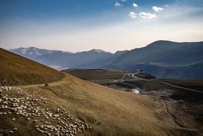 Scenic view of landscape and mountains against sky