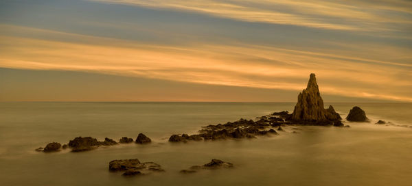 Scenic view of sea against sky during sunset