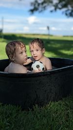 The twins playing in the water