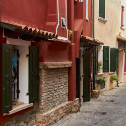 Alley amidst buildings in city