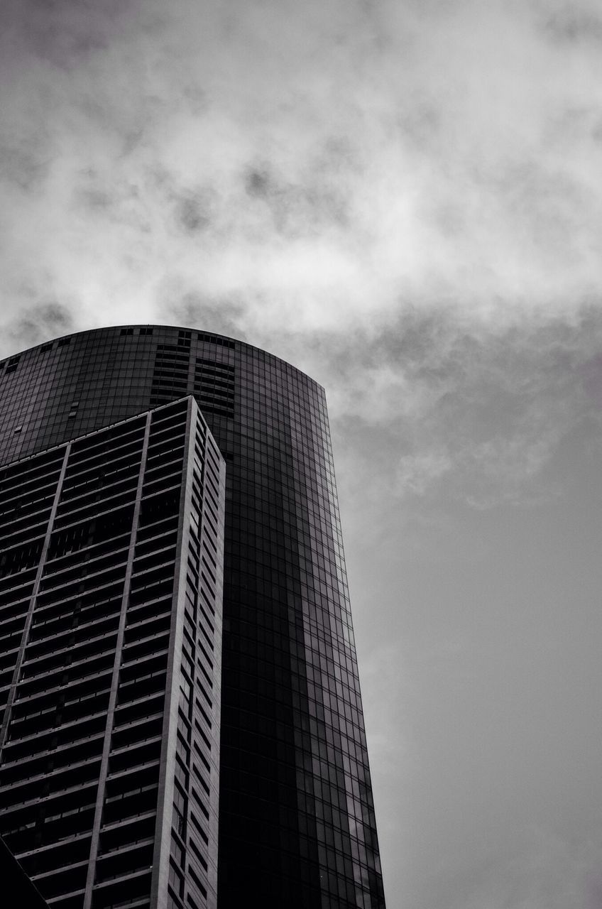 architecture, building exterior, low angle view, built structure, modern, sky, tall - high, skyscraper, office building, city, cloud - sky, tower, building, cloudy, glass - material, cloud, tall, day, outdoors, no people