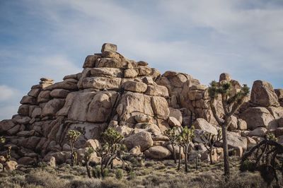 Low angle view of rock against sky