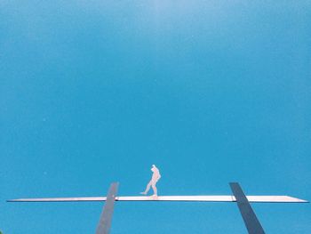 Low angle view of tree against clear blue sky