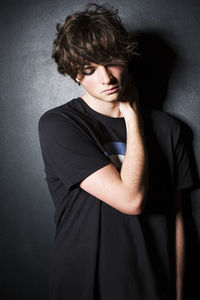 Portrait of young man against white background