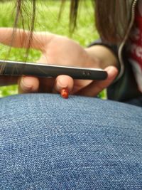 Close-up of person holding camera