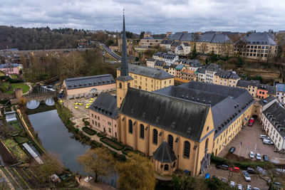 View of a monastery along the river alzette in the city of luxembourg.