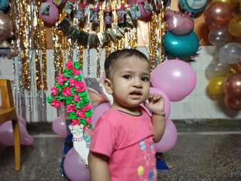 Portrait of cute girl with balloons