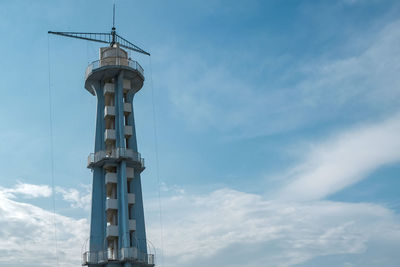 Low angle view of parachute tower against sky