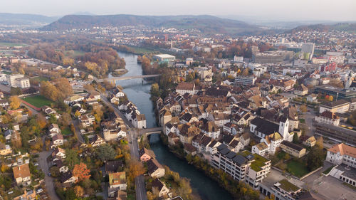 High angle view of river amidst buildings in town