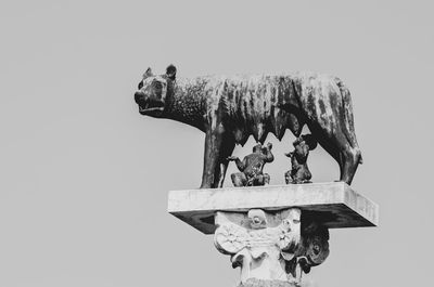 Low angle view of horse statue against clear sky