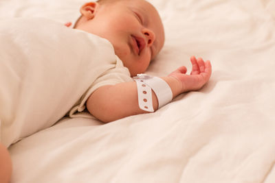 Cute baby lying on bed at home