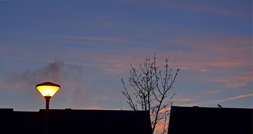 Low angle view of building against sky at dusk