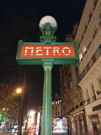 Low angle view of illuminated street light at night