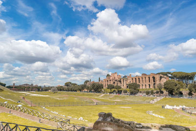 View of old ruins against cloudy sky