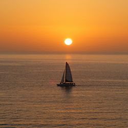 Scenic view of sea at sunset