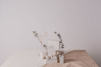 Close-up of concrete blocks and vases on table at home