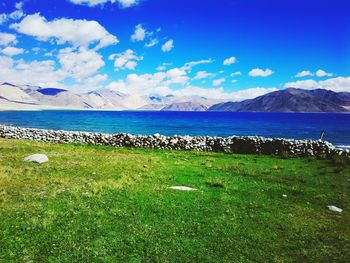 Scenic view of landscape against cloudy sky