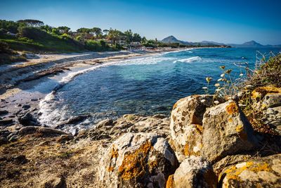 Scenic view of sea against blue sky