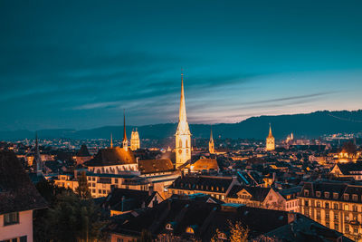 High angle view of illuminated buildings in city