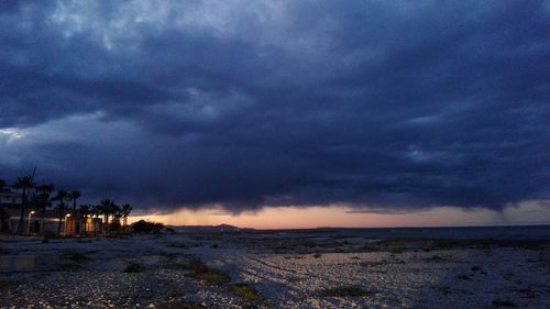 Scenic view of sea against dramatic sky