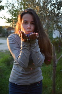 Portrait of teenage girl wearing sunglasses outdoors