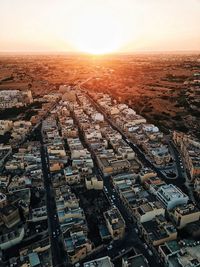 High angle view of townscape against sky during sunset