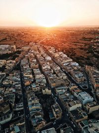 High angle view of townscape against sky during sunset