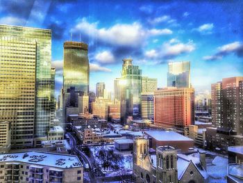 City skyline against cloudy sky