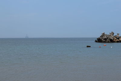 Scenic view of sea against clear sky