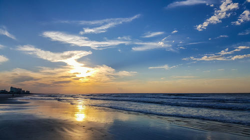 Scenic view of sea against sky at sunset