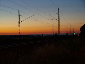 Silhouette landscape against sky during sunset